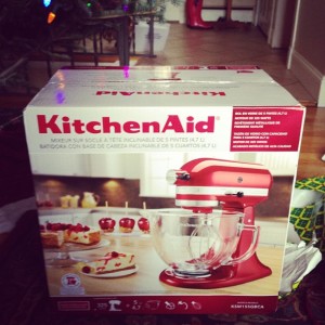 Photo of red KitchenAid mixer in box.